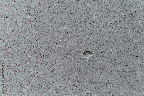 Surface of the decorative concrete panel texture closeup, composed of approxi...