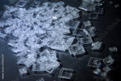 Silver nitrate crystals stock images. Laboratory accessories stock images. Laboratory equipment. AgNO3 images. Chemical compounds isolated on a black background. Chemical reaction images