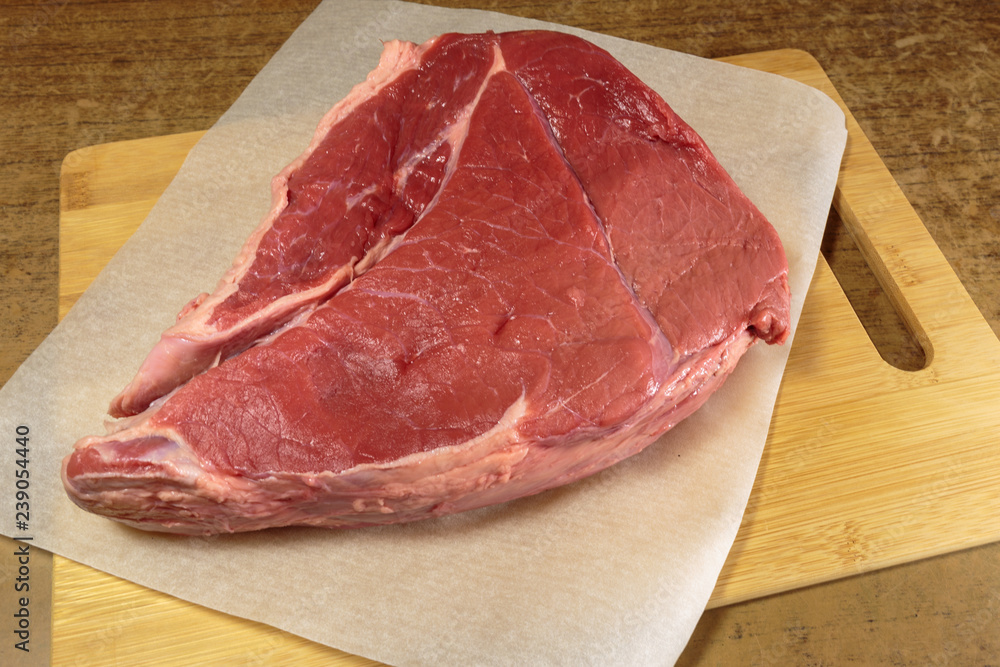 Fresh raw beef on a kitchen table.