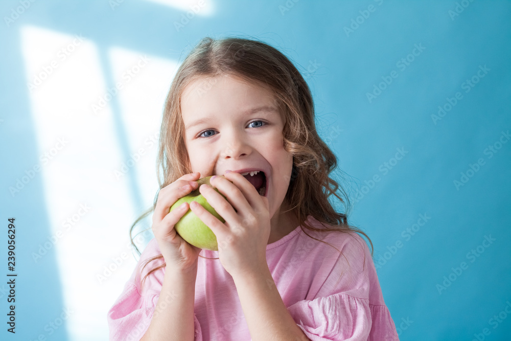 little girl eating a Green Apple fruit vitamins little girl eating a Green Apple fruit vitamins