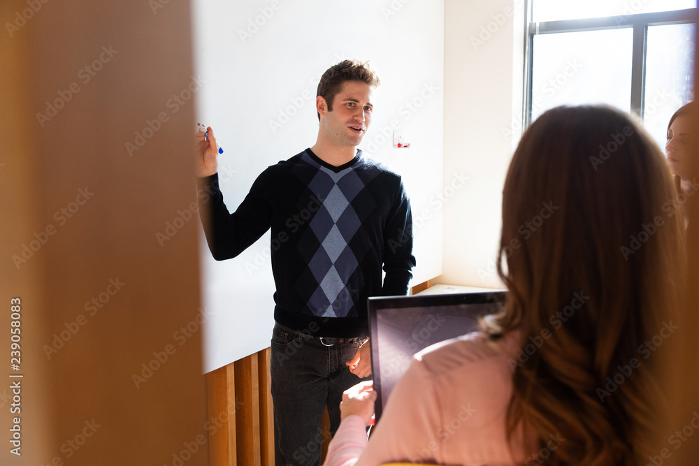 Team meeting in office space for brainstorming session Team meeting in office space for brainstorming session