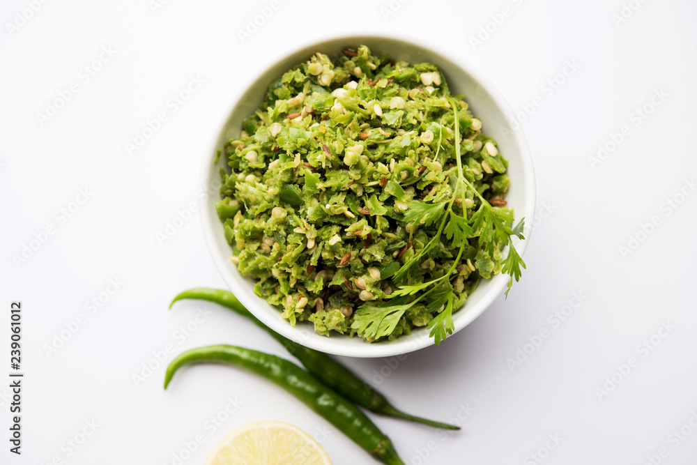Hot and spicy green chilli chutney using hari mirch, cumin seeds, lemon juice and coriander. served in a bowl. selective focus Hot and spicy green chilli chutney using hari mirch, cumin seeds, lemon juice and coriander. served in a bowl. selective focus