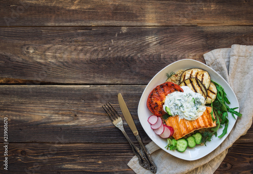 Grilled salmon, eggplants and tomatoes with quinoa and tzatziki sauce