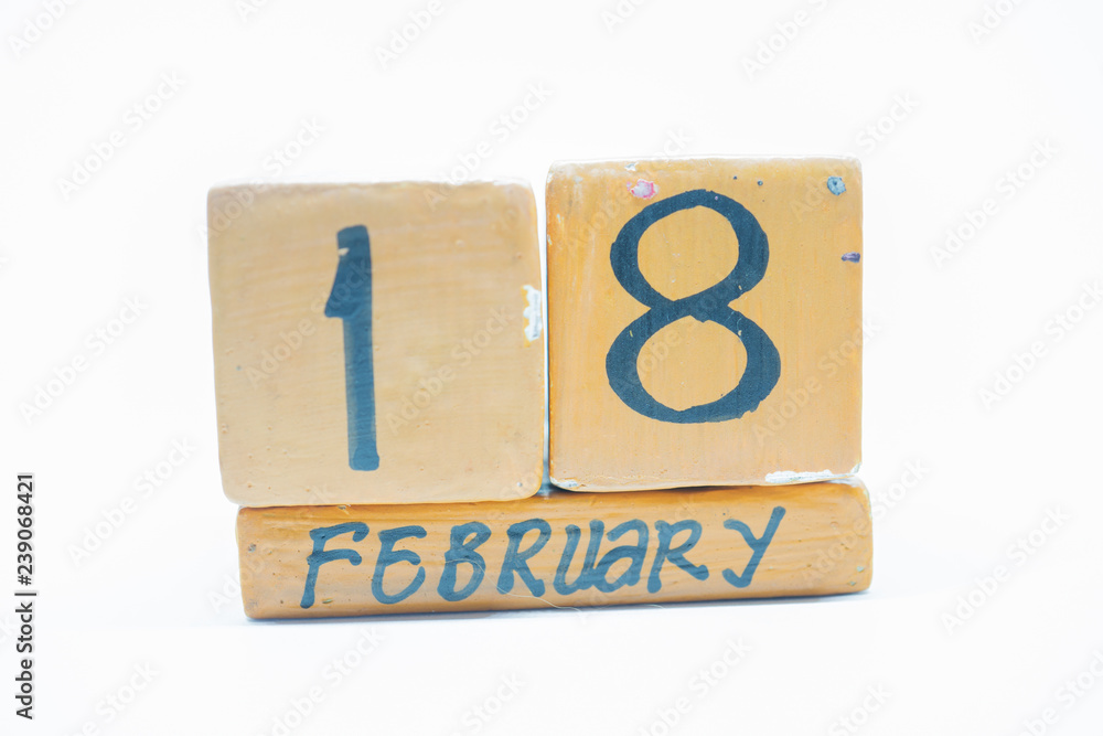 February 18th. Day 18 of month, handmade wood calendar isolated on white background. Winter month, day of the year concept. February 18th. Day 18 of month, handmade wood calendar isolated on white background. Winter month, day of the year concept.