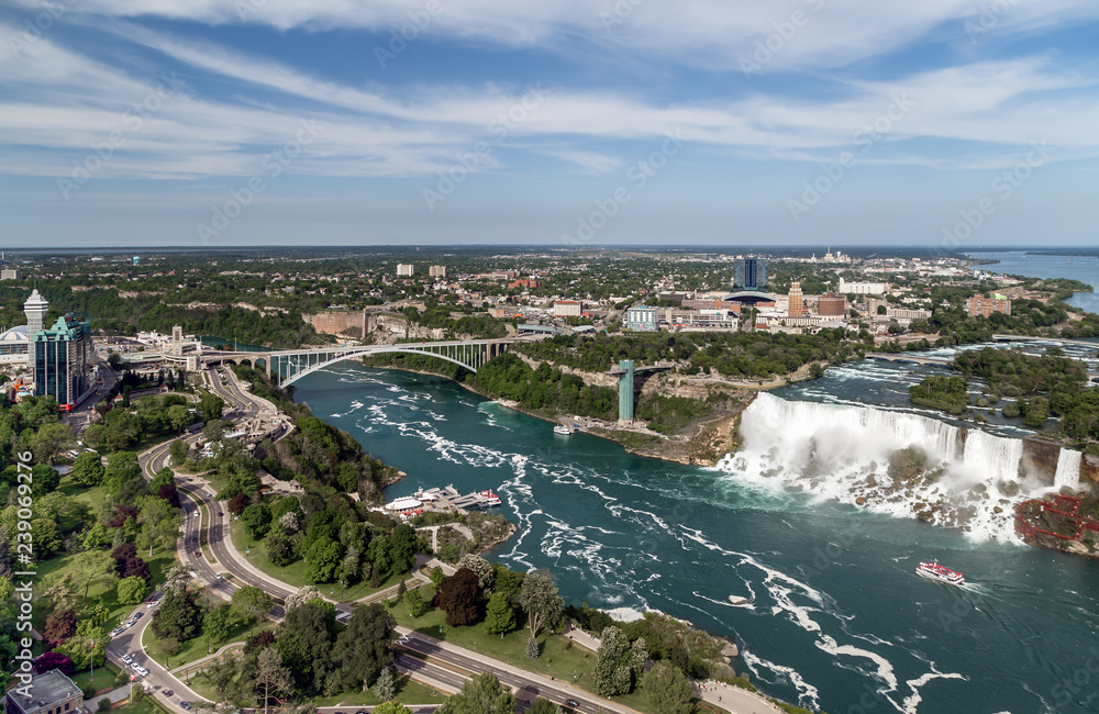 Breathtaking aerial view of Niagara Falls, Rainbow bridge, Niagara river from Canadian side.