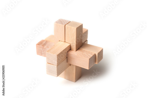 closeup of solved wooden puzzle  on white background