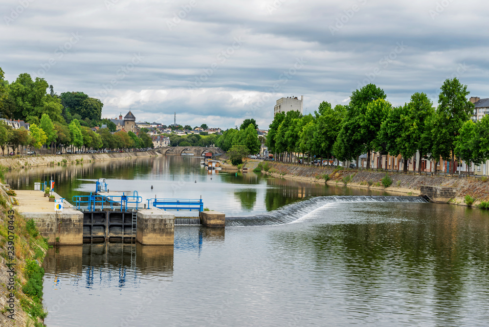 Banks of the Mayenne river, City of Laval, Mayenne, Pays de Loire, France. August 5, 2018 Banks of the Mayenne river, City of Laval, Mayenne, Pays de Loire, France. August 5, 2018