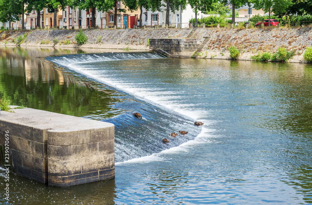 Banks of the Mayenne river, City of Laval, Mayenne, Pays de Loire, France. August 5, 2018 Banks of the Mayenne river, City of Laval, Mayenne, Pays de Loire, France. August 5, 2018