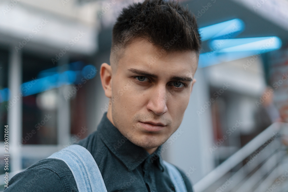 Portrait young man on blurred city background