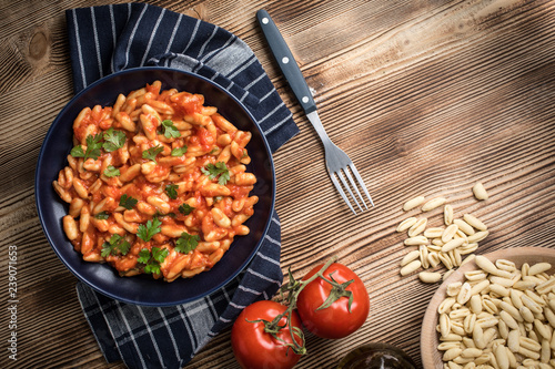 Cavatelli pasta with fresh tomato sauce. photo