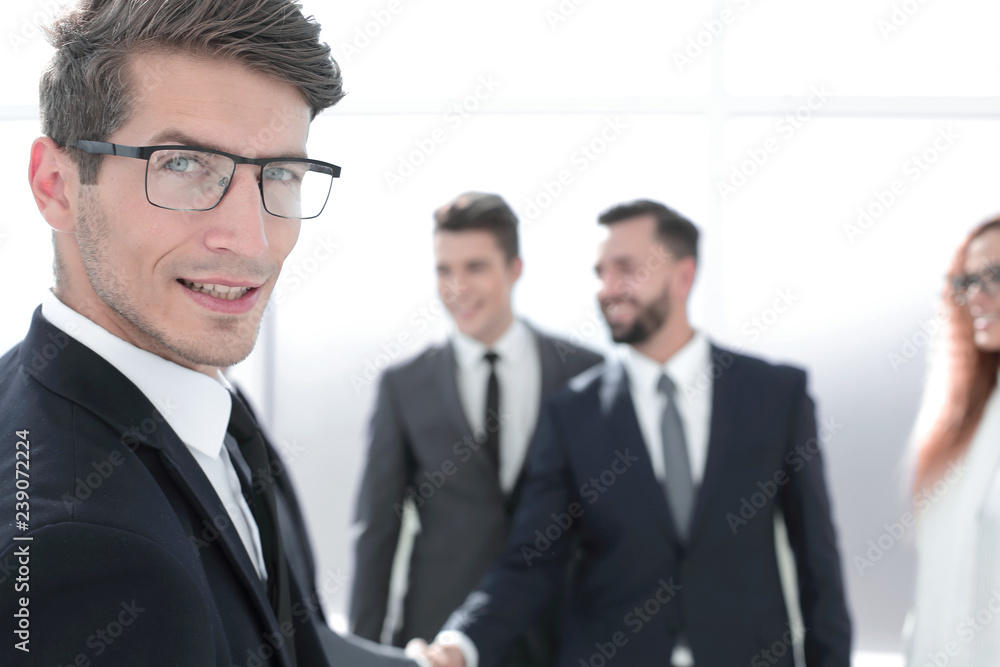 close up.successful businessman standing in the office close up.successful businessman standing in the office