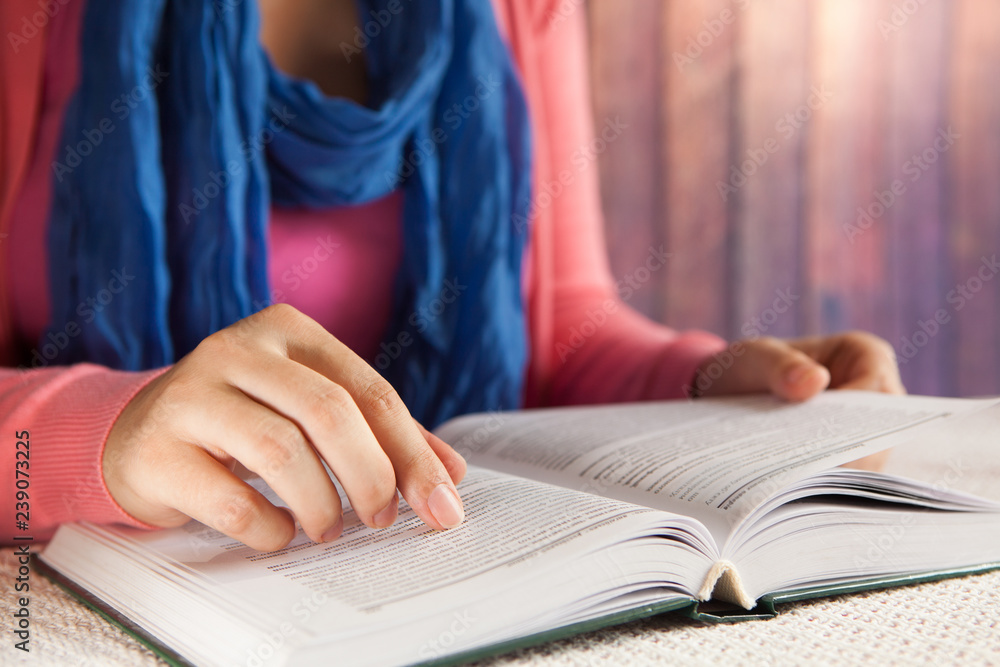 Young woman student read book indoors, leisure or education concept Young woman student read book indoors, leisure or education concept