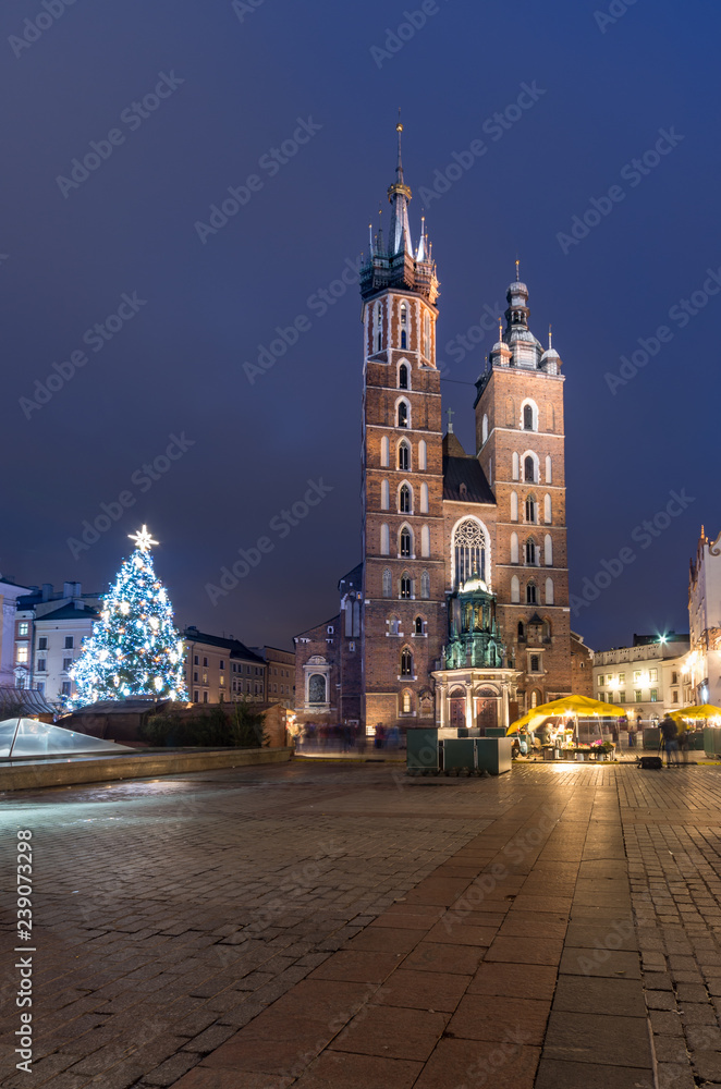 Naklejka premium Krakow, Poland, Christmas on Main Market Square and St Mary's church