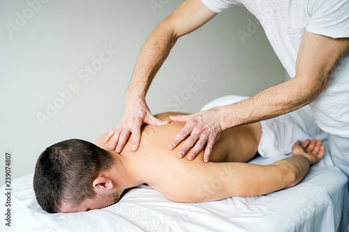 Young Man Receiving Sport Massage 