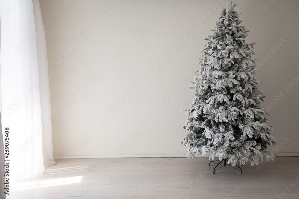 Holiday Interior White Christmas tree with gifts and decorations garlands of lights new year Holiday Interior White Christmas tree with gifts and decorations garlands of lights new year