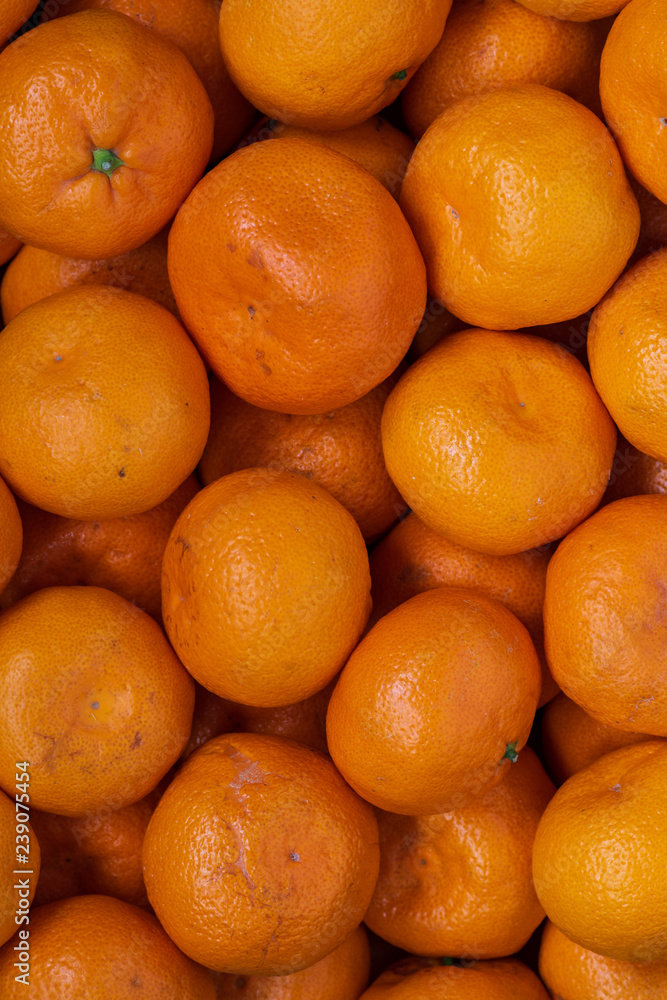 Top view of ripe tangerines background. orange vitamins Top view of ripe tangerines background. orange vitamins