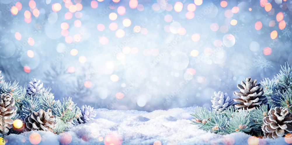 Obraz premium Winter Background With Fir Branches On Snow And Lights 