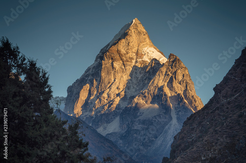 Golden light on an beautiful Himalayan mountain peak.
