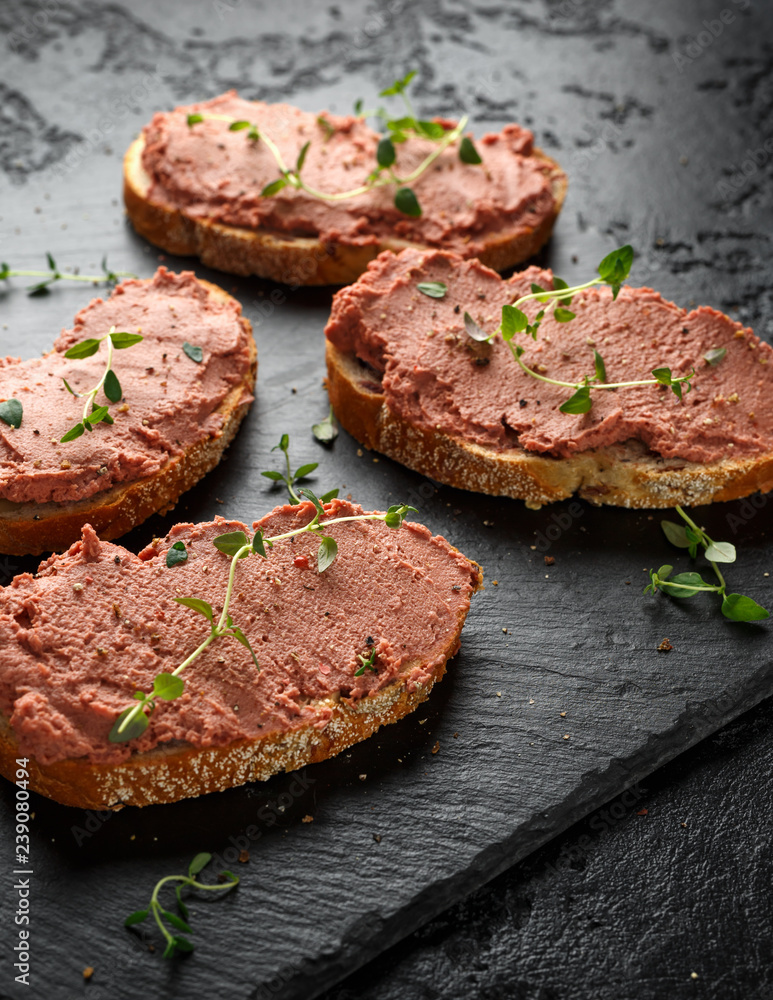 Fresh homemade chicken liver pate on bread Fresh homemade chicken liver pate on bread