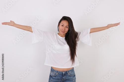 Happy Asian Woman with open Hands against white background. Freedom concept photo