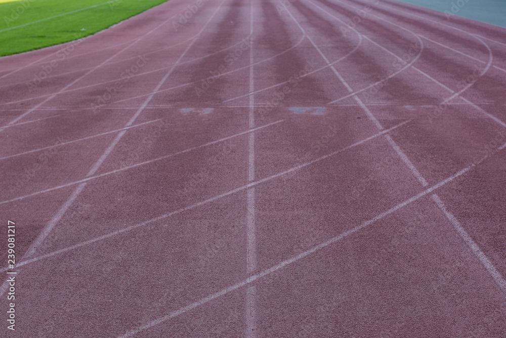 running dirty old track marking road background material texture in football stadium perspective foreshortening, copy space 