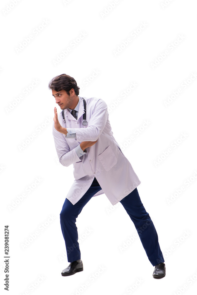 Young handsome doctor under pressure isolated on white Young handsome doctor under pressure isolated on white