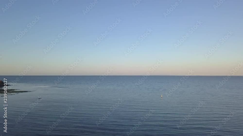 Flying over cast ocean with clear sky. Flying over cast ocean with clear sky.