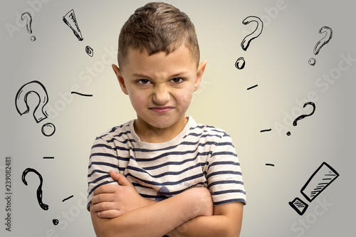 Canvas Print portrait of a little frowning boy. Emotions