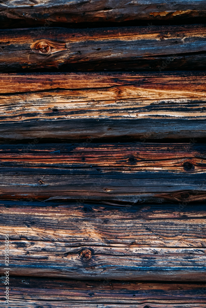 Brown wood wall background texture. Planks of wood damaged by the aging process. Old wooden wall. Brown wood wall background texture. Planks of wood damaged by the aging process. Old wooden wall.