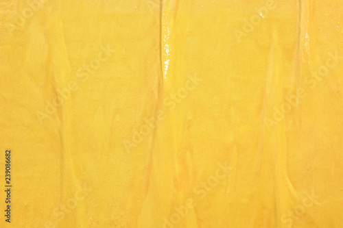 Old yellow wrinkled weathered poster grunge background ripped torn creased crumpled paper backdrop surface