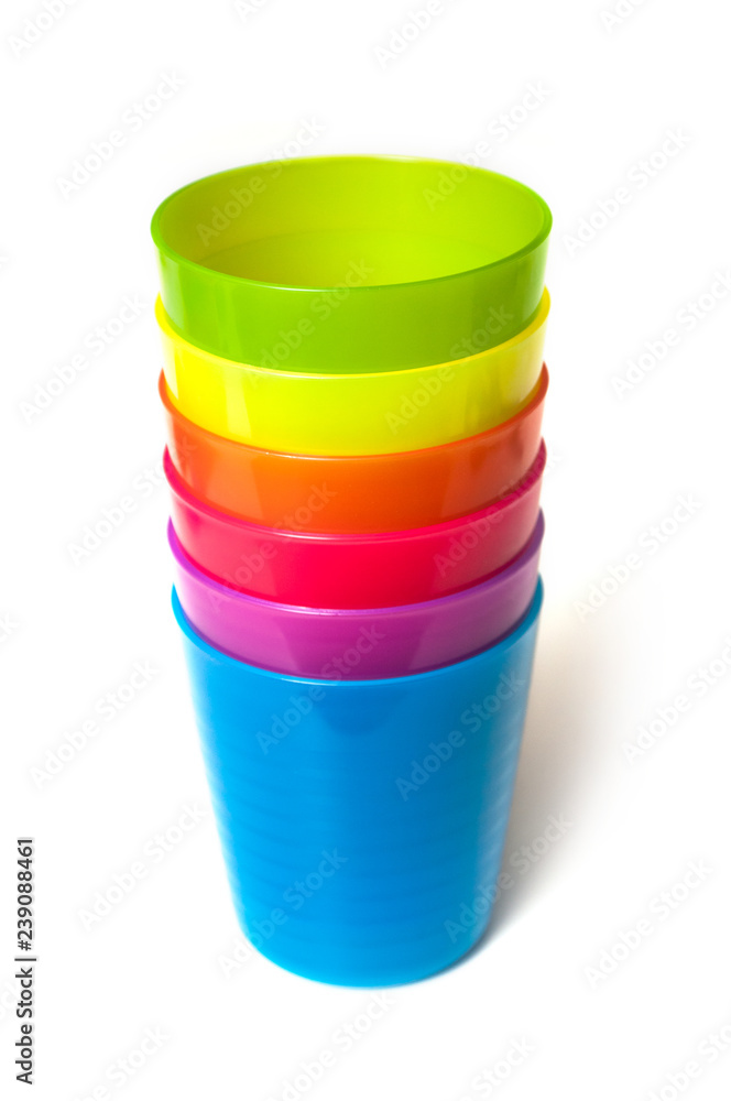set of colorful baby plastic cups on white background set of colorful baby plastic cups on white background