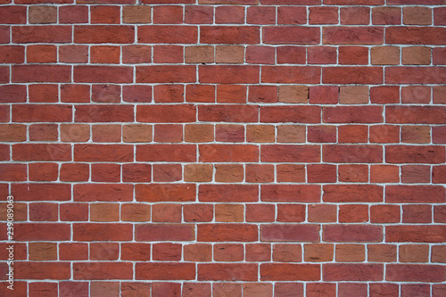 red brick wall with cemented joints