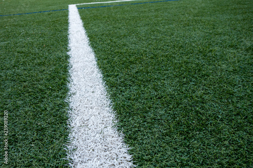 painted white boundary lines of a artficial plastic lawn