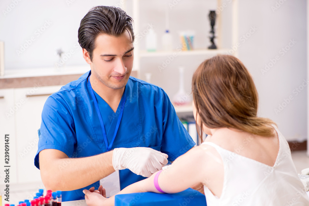 Young patient during blood test sampling procedure Young patient during blood test sampling procedure