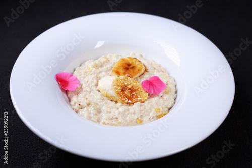 Healthy breakfast. oatmeal porridge with caramelized bananas. Clean eating, vegetarian, vegan, diet food concept