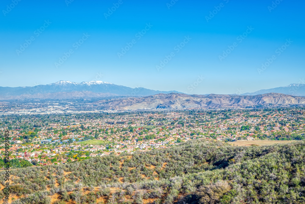 Suburbs of California on clear winter afternoon with blue sky for text