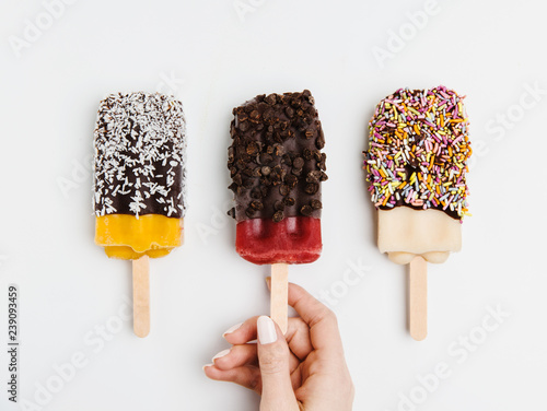 Assorted popsicles dipped in chocolate, coconut, sprinkles and chocolate chips