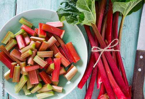 pieces of rhubarb on turquoise wooden surface photo