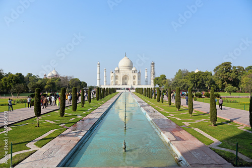 Taj Mahal on a bright and clear day reflected in the water, India