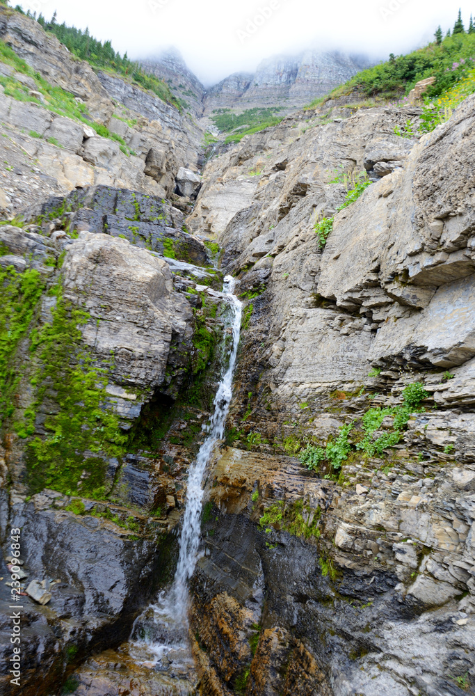 Waterfalls from melting glaciers and snow in Glacier National Park.