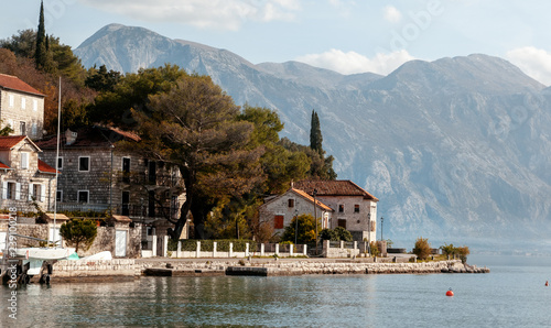 Village Perast on coast of Boka Kotor bay - Montenegro - nature and architecture background, popular travel destination in Europe © olezzo