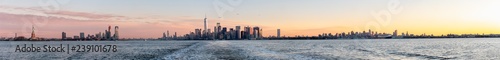 Very Wide Panorama of Manhattan and New Jersey Skyline with The Statue of Liberty on the Side © porqueno