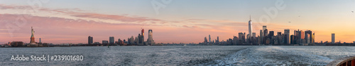 View of the Statue of Liberty From the Staten Island Ferry with Downtown Manhattan on the Right © porqueno