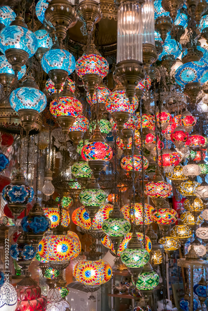 Decorative mosaics chandelier lamps hang inside Grand Bazaar in Istanbul, Turkey.
