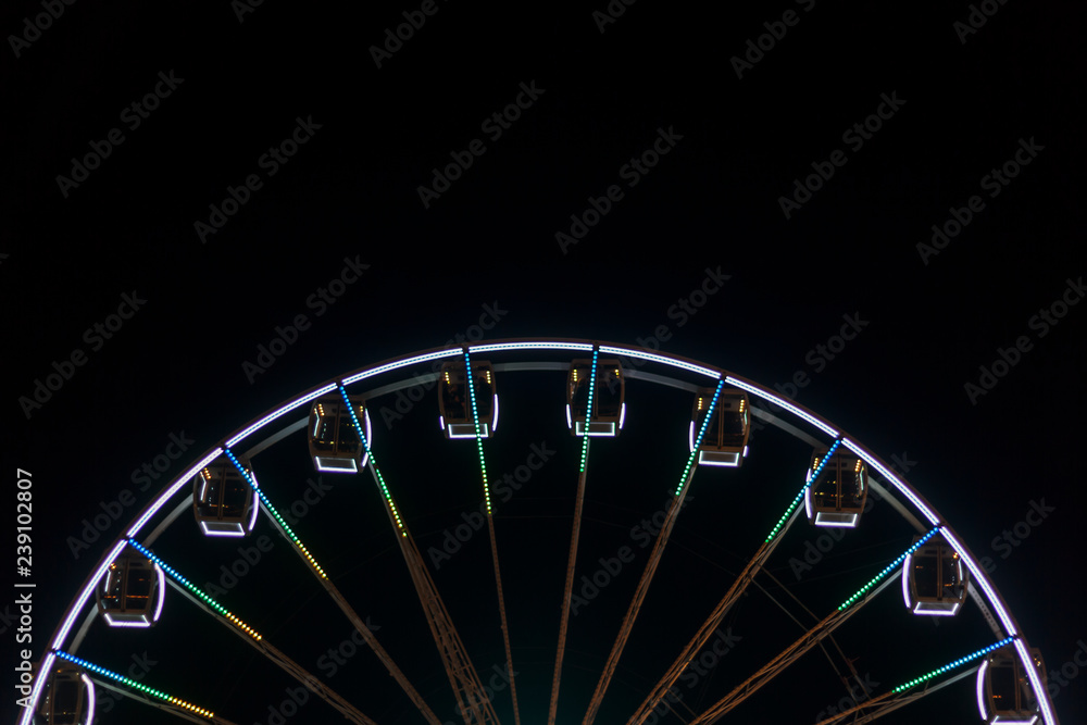 Ferris wheel spinning at night