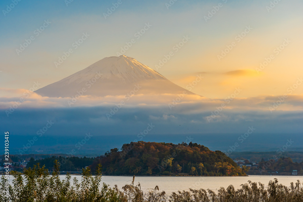 Beautiful landscape of mountain fuji with maple leaf tree around lake