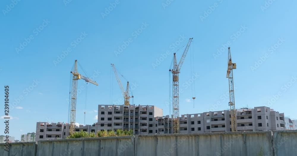 Time lapse tower cranes against blue sky no birds, nonflicker. Time lapse tower cranes against blue sky no birds, nonflicker.