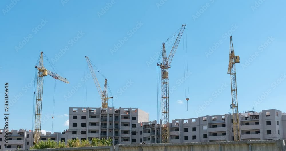 Time lapse tower cranes against blue sky no birds, nonflicker. Time lapse tower cranes against blue sky no birds, nonflicker.