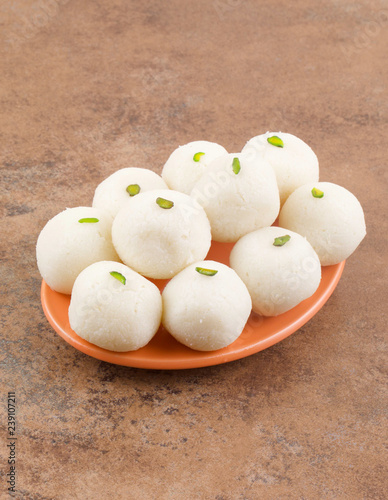 Indian Sweet Rasgulla Also Know as Rosogolla, Roshogolla, Rasagola, Ras Gulla, Anguri Rasgulla or Angoori Rasgulla is a Syrupy Dessert Popular in India. It is Made From Ball Shaped Dumplings photo