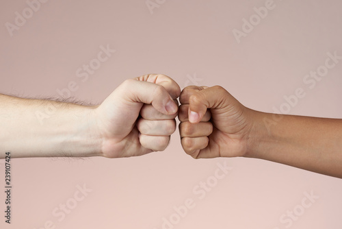 2 fists bumping each other photo